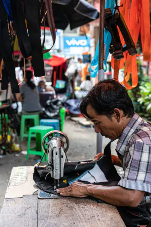 Man working with sewing machine