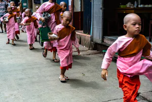 Little nuns walking sidewalk