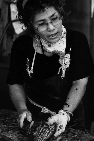 Woman scraping scales off