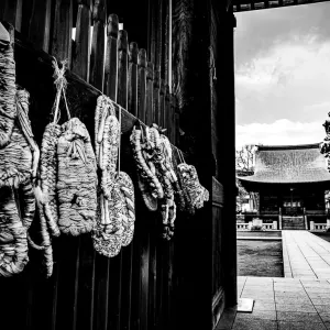 Straw sandals hung on wall in Buddhist temple