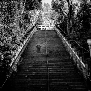 Businessman on the steep stairway to Atago Jinja