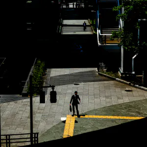 Businessman walking a sidewalk