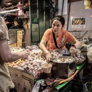 Woman selling paste products in market