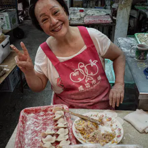 Woman making Jaozi in market