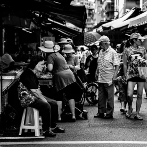 Woman staying motionless in local market