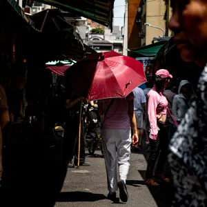 Umbrella among shoppers in Bailan Market