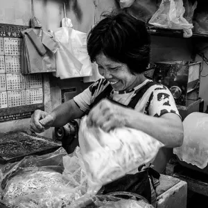 Bashful clerk working in a noodle making shop