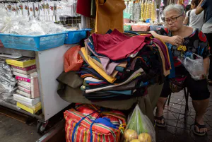 Woman staring at what she is selling