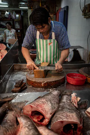 Fishmonger sharpening a knife