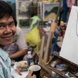 Smile of a painter in Chatuchak Market