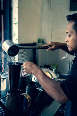 Man making some coffee with a fabric filter