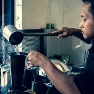 Man making some coffee with a fabric filter