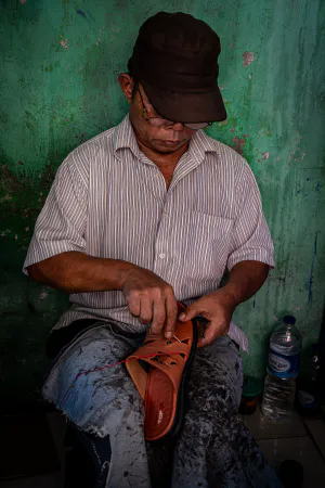 Shoe repairman in Glodok district