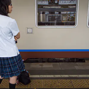 high school girl standing on platform