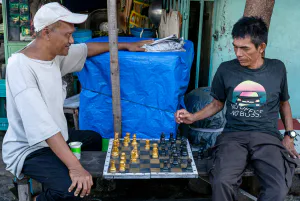 Men playing chess in the residential area