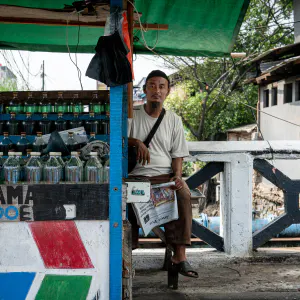 Man selling light diesel oil on the bridge