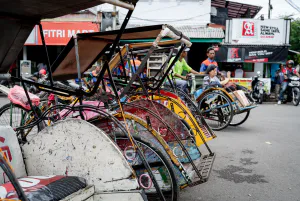 Becak parked in front of Cirebon station