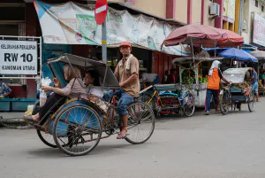 Becak running with female customers