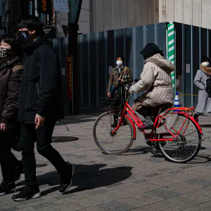 Pedestrians and a bicycle