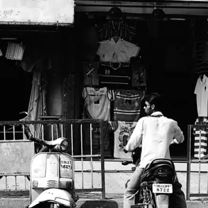 Two motorbikes in front of shop