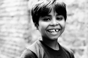Boy showing white teeth