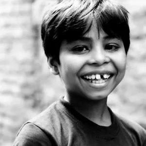 Boy showing white teeth