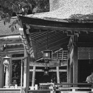 Shinto priest under thatched roof