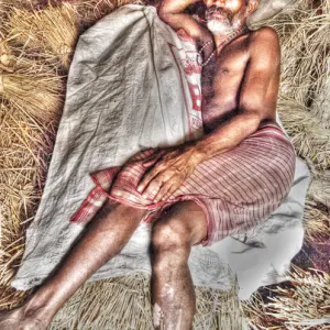 Man lying down on wheat straw