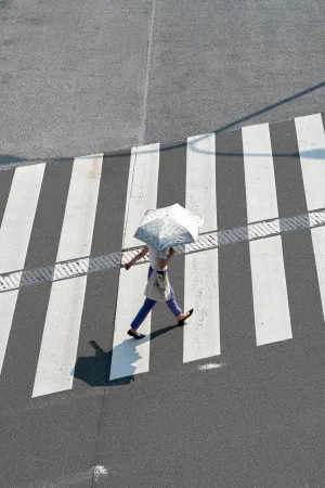Woman walking with parasol