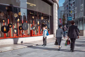 Boy standing in front of Ginza Wako