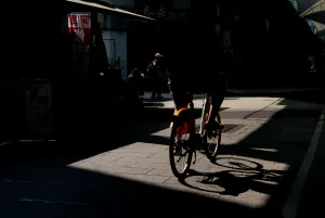 Bicycle riding through a shopping street