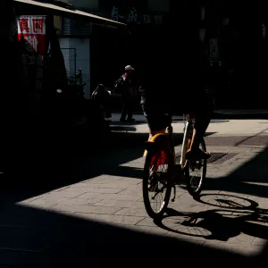 Bicycle riding through a shopping street