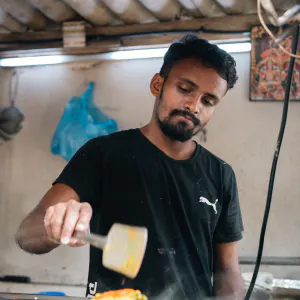 Man baking dosa