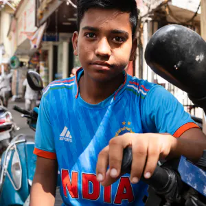 Young man in India's national cricket uniform