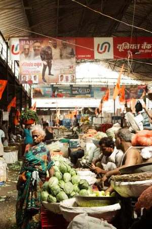 Woman standing next to cabbage