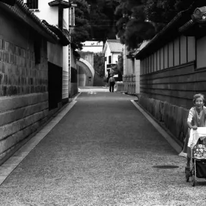 Older woman pushing trolley