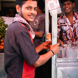 Young man at the juice stand