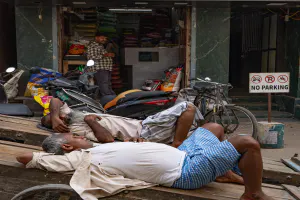 Men sleeping on carts