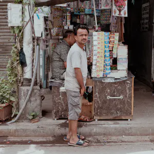 Man wearing sandals with Louis Vuitton logo