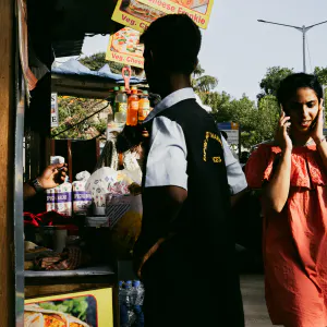 Woman walking while talking on cell phone