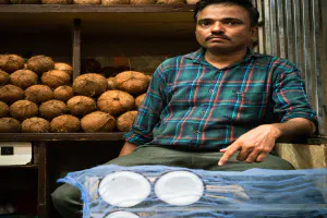 Man selling coconuts