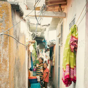 Girls standing in an alley