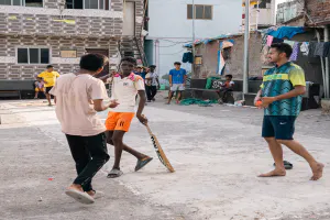 Men playing cricket