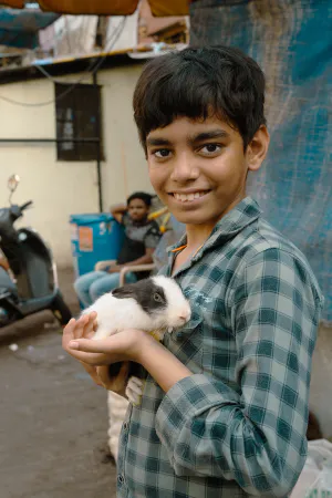 Boy holding a rabbit