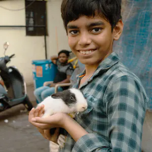 Boy holding a rabbit