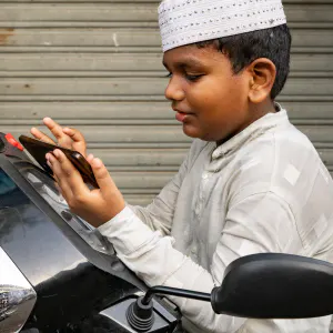 Boy playing a smartphone game