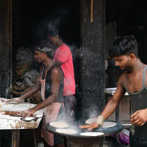 Men making rotis