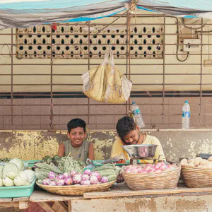 Parent and child working at a grocery store