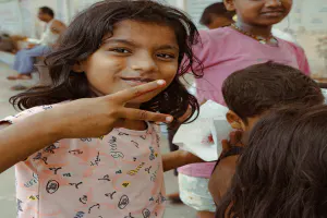 Girl making a peace sign