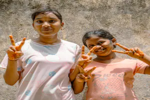 Girls making peace sign